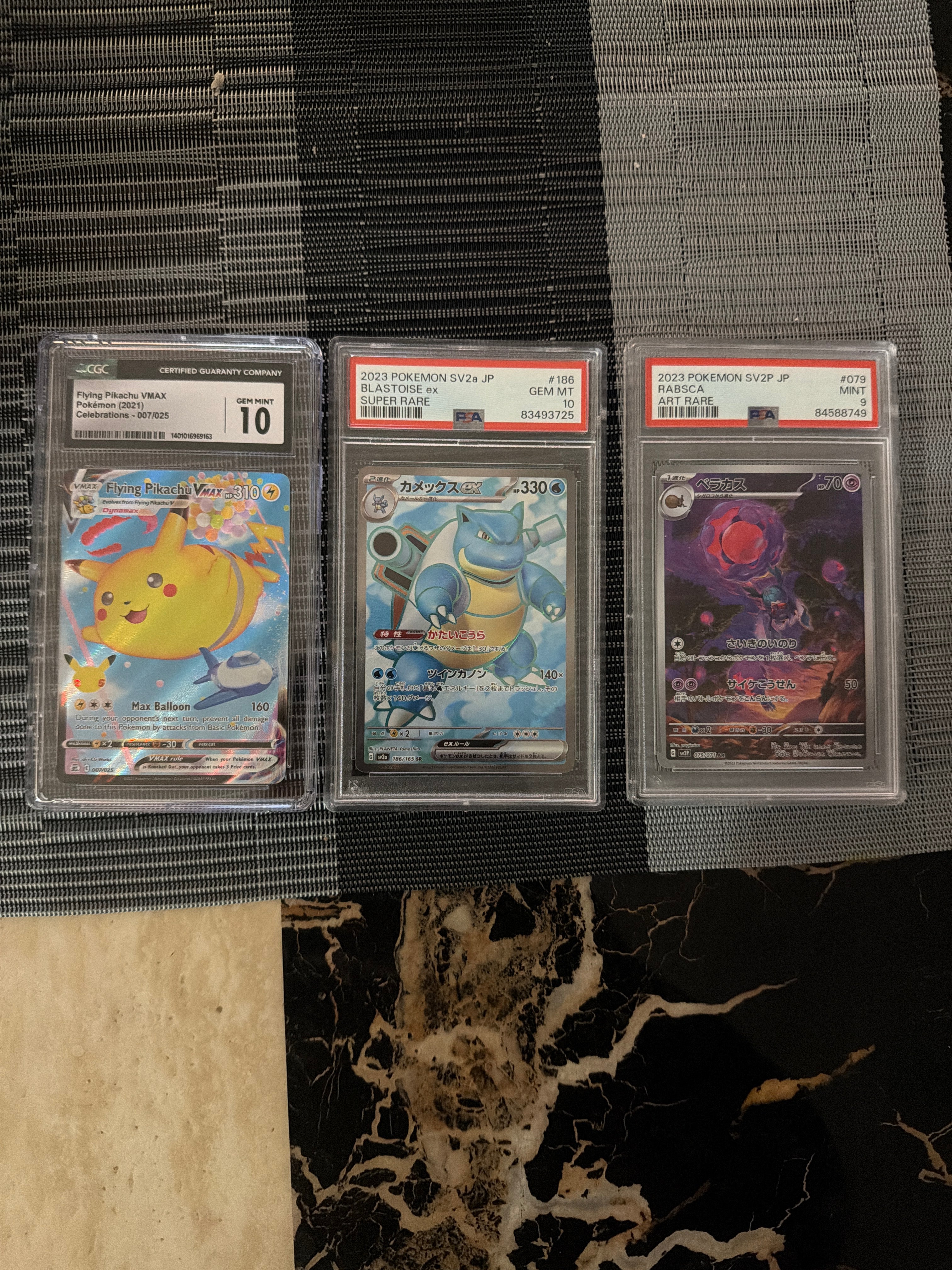 3 graded pokemon slabs